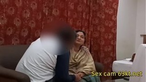 Chubby Indian auntie gets naughty with her lover in living room