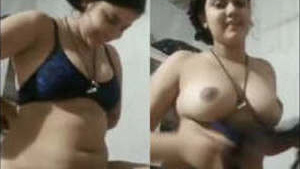 Bhabhi flaunts her breasts and pussy in a seductive manner