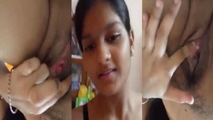 Busty girl pleasures herself with her fingers