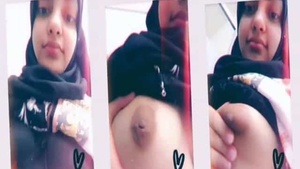 Adorable Hijabi woman flaunts her ample bosom on camera