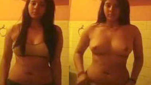 Desi babe flaunts her big boobs in a bathroom video