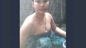 Indian woman takes a bath in the countryside