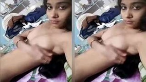 Exclusive video of a gorgeous girl playing with her big tits and pleasing herself