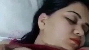 Watch as a bhabhi pretends to be asleep while her devar fondles her big boobs in a sexy video