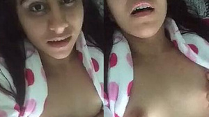 Teen girl masturbates with her tits and pussy on camera