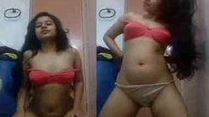 An Indian girl with a charming smile and a seductive body performs solo XXX acts