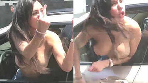 Sexy brunette goes topless and screams in public while driving