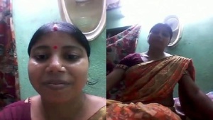 Tamil aunty's boobs and pussy get a workout in homemade video
