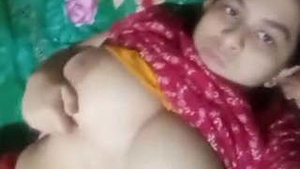 Busty Indian babe flaunts her assets in a revealing outfit
