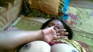 Indian auntie bares her breasts and pussy for the camera
