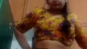 Cute Tamil girl brushes and cleans her pussy in a naked video