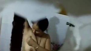 Anita, the neighboring bhabhi, indulges in a steamy shower with her partner