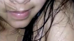A stunning Desi woman indulges in steamy shower play