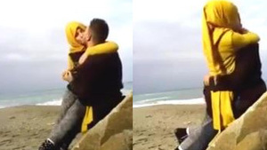 Hijab-clad women indulge in passionate kissing
